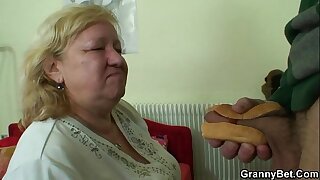 Busty granny tastes mouth-watering cock